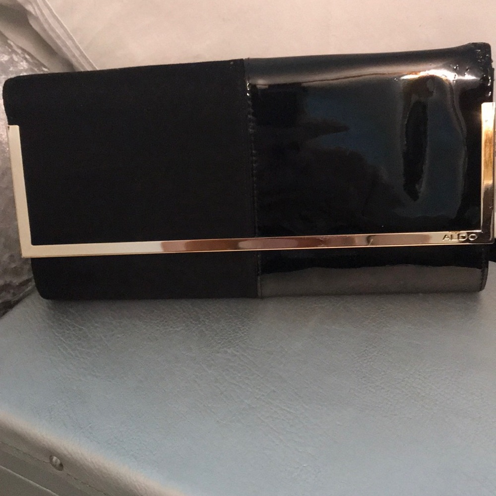 Black suede and patent leather clutch bag